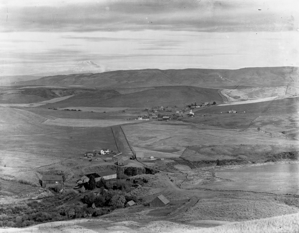 Aerial view of Boyd showing Boyd roller mill and 15-Mile Creek in foreground and Mt. Adams in distance, 1903.