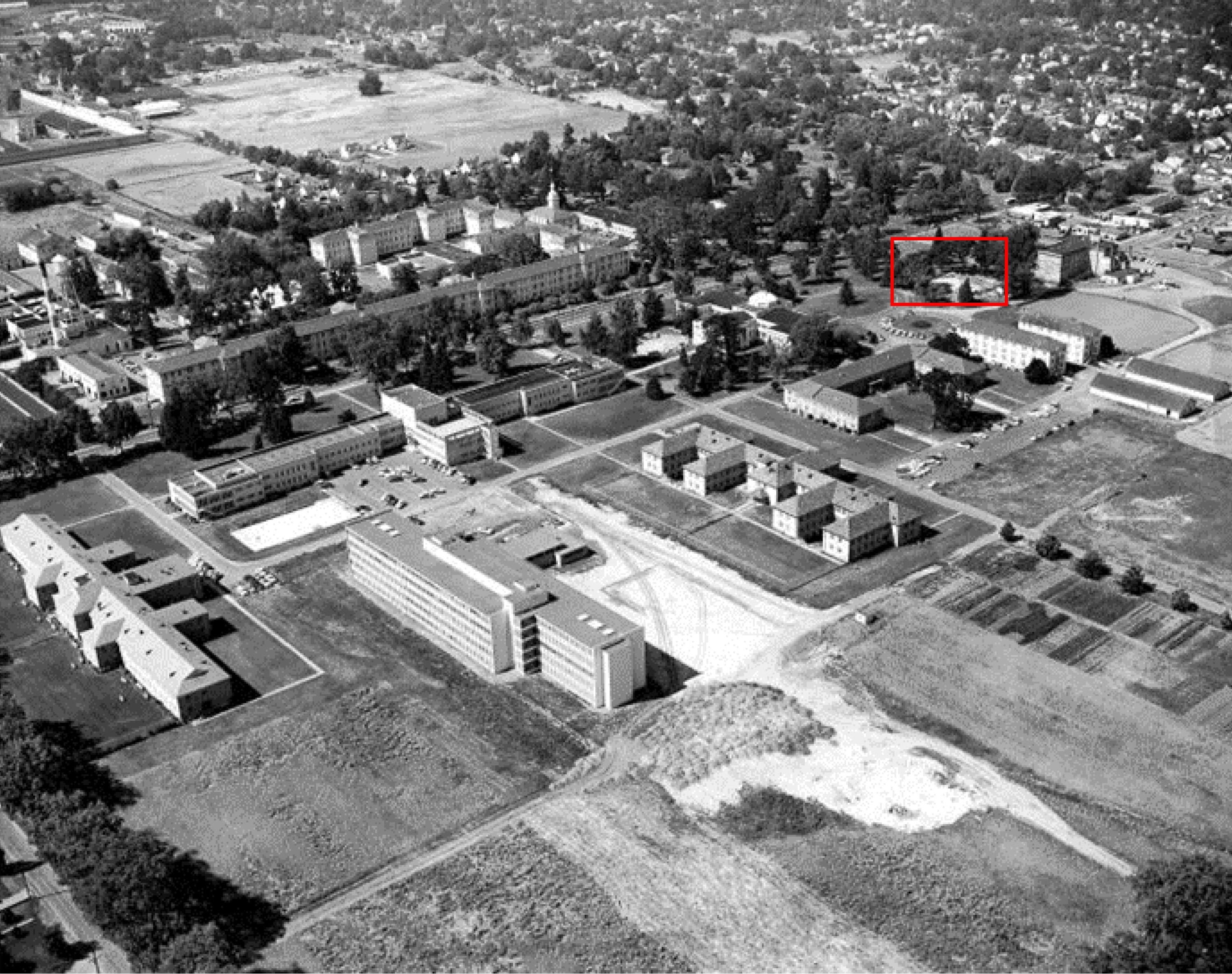A circa 1956 aerial photograph of Oregon State Hospital after the buildings in the eastern portion of the North Campus were constructed. The building that once was the Glen Oaks Orphan’s Home appears to have been recently removed in this photograph (the red rectangle). The view is towards the southwest.