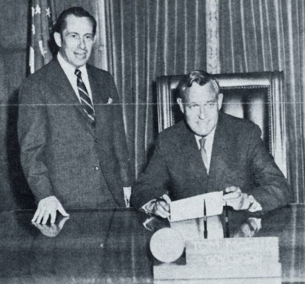 Governor Tom McCall (right) signs inventory tax relief legislation in 1969, flanked by AOI director Douglas Heider.