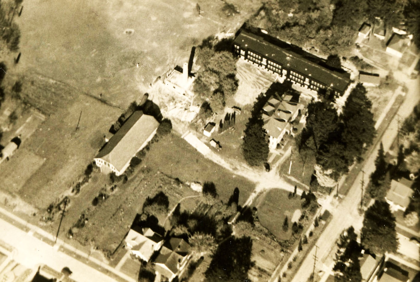 Concordia University. Clockwise from top: Centennial Hall; President's home; faculty home; gymnasium; heating plant.