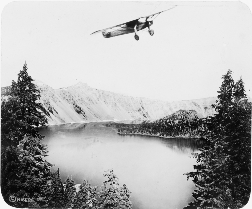 Charles Lindbergh flies over Crater Lake.