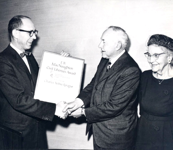 Charles Davis presents ACLU award to Gov. Sprague, 1962. Blanche Sprague stands to the right.