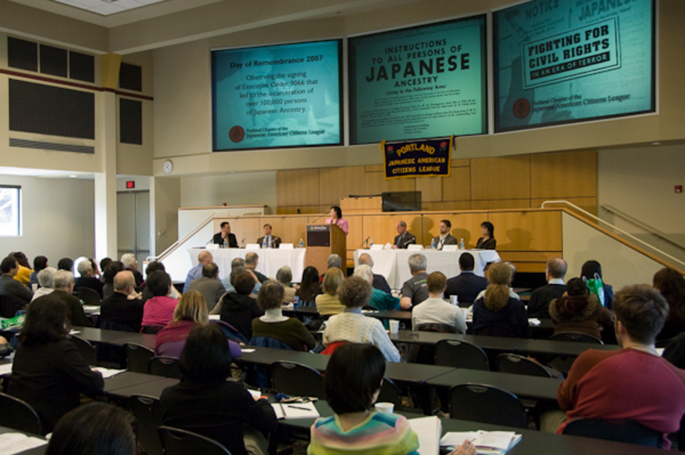 Peggy Nagae speaking as one of five panelists during 2007 Day of Remembrance event at Portland State University.