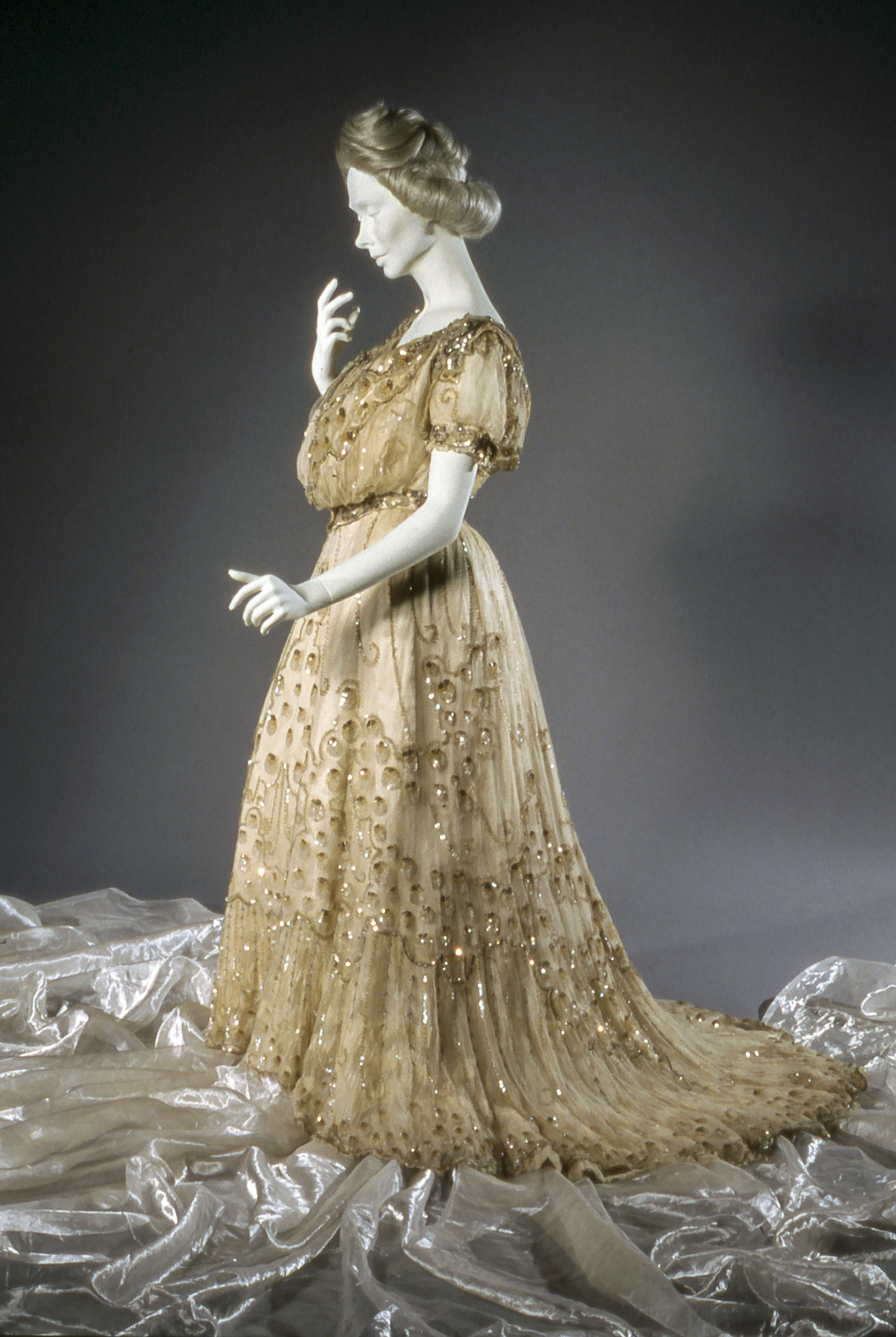 Silk satin, taffeta and tulle evening gown with ornamental beading. It belonged to Mrs. Ralph Williams of Portland.