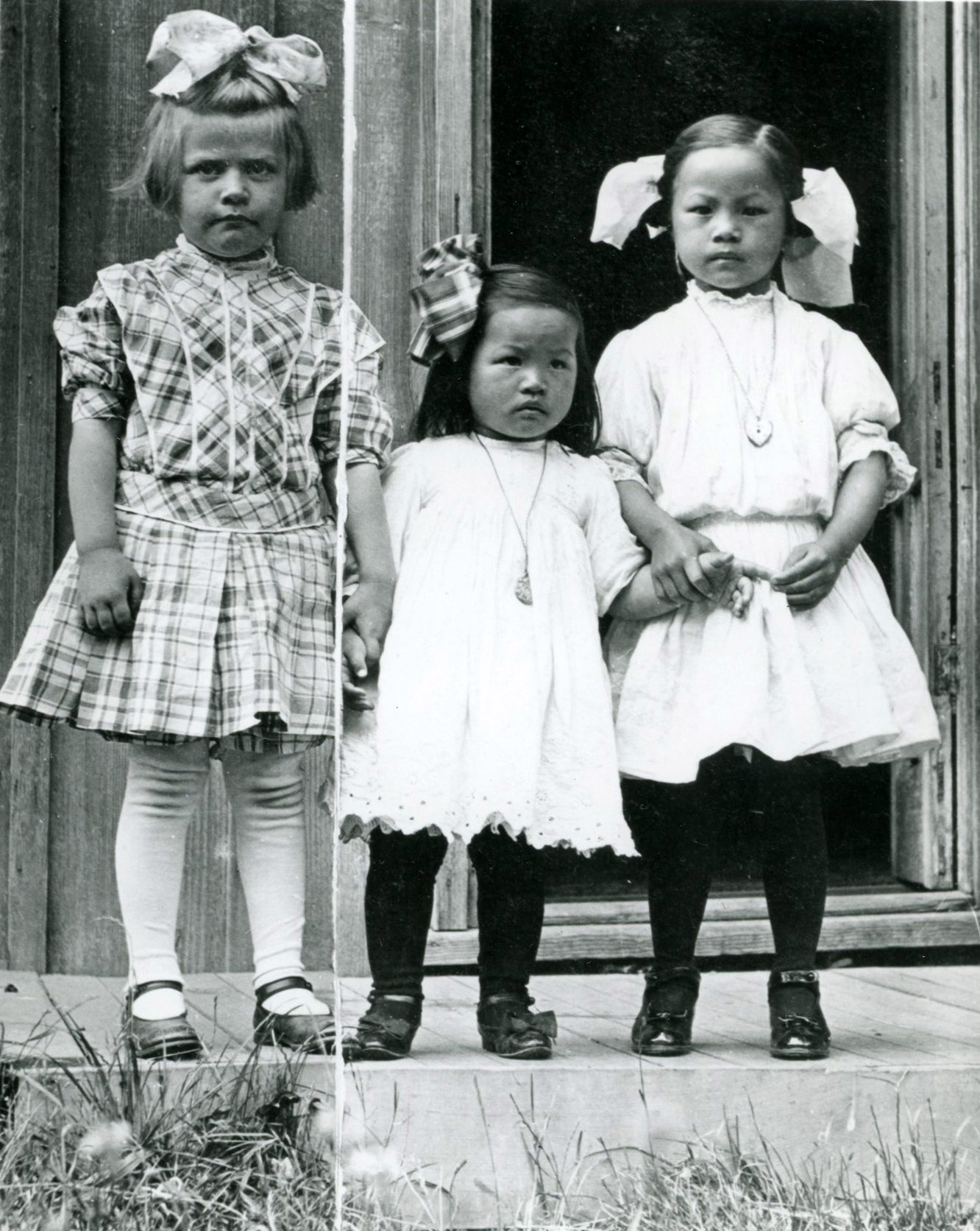 Author says photo was cut to give Coe family a version with just their daughters.