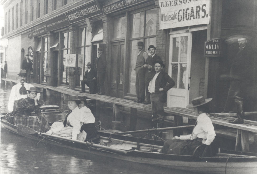 Henrietta Failing, far left in boat (Elsie Failing, far right), during 1894 flood in Portland