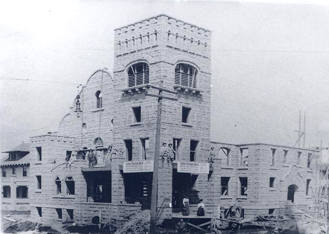 Construction, 1909; Woman on right is Mrs. Gorhmley, wife of pastor.