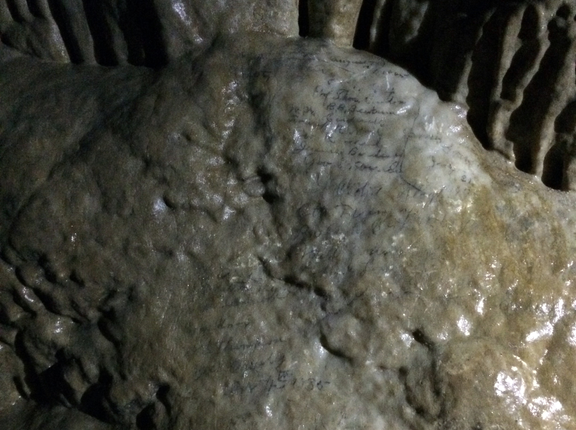 The pencil marks are preserved by a layer of calcite, and were still visible when this photo was taken in 2016.