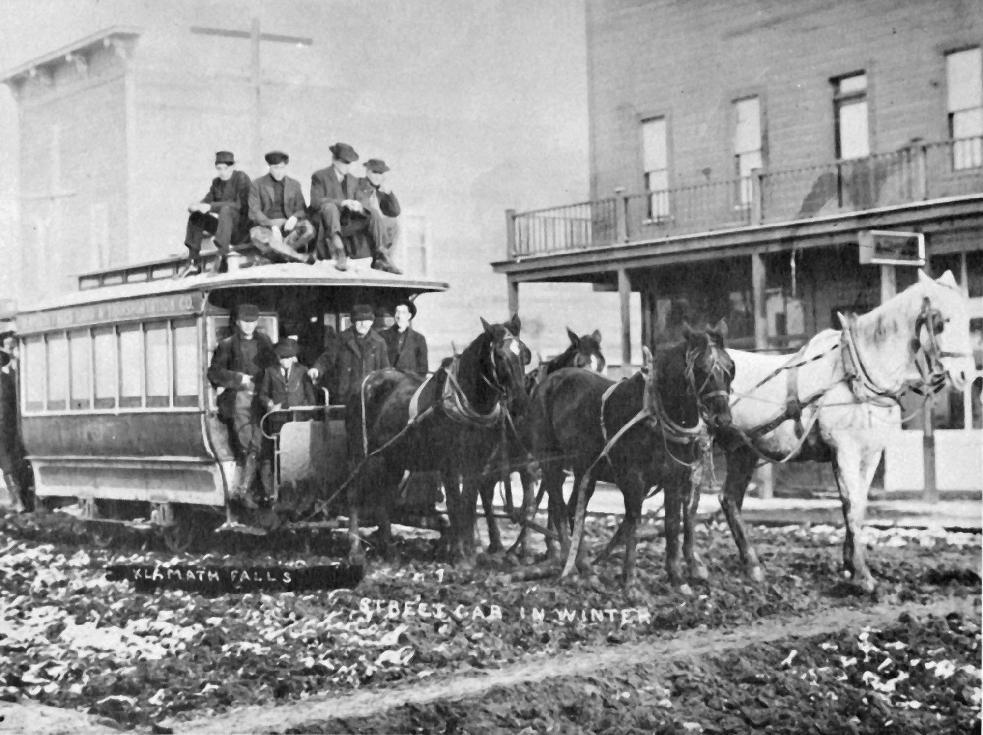 KFL&T streetcar headed west on Main St. between 6th and 7th, American Hotel at right, Charlie Adams driver