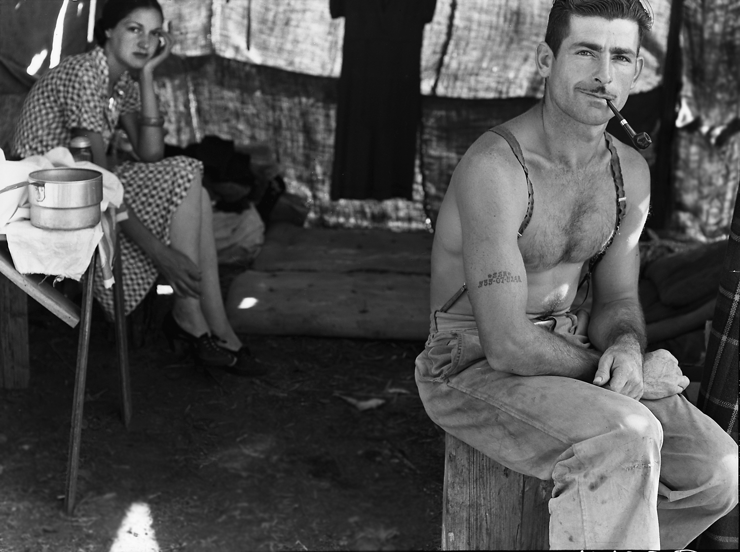 Note social security number tattooed on right arm.