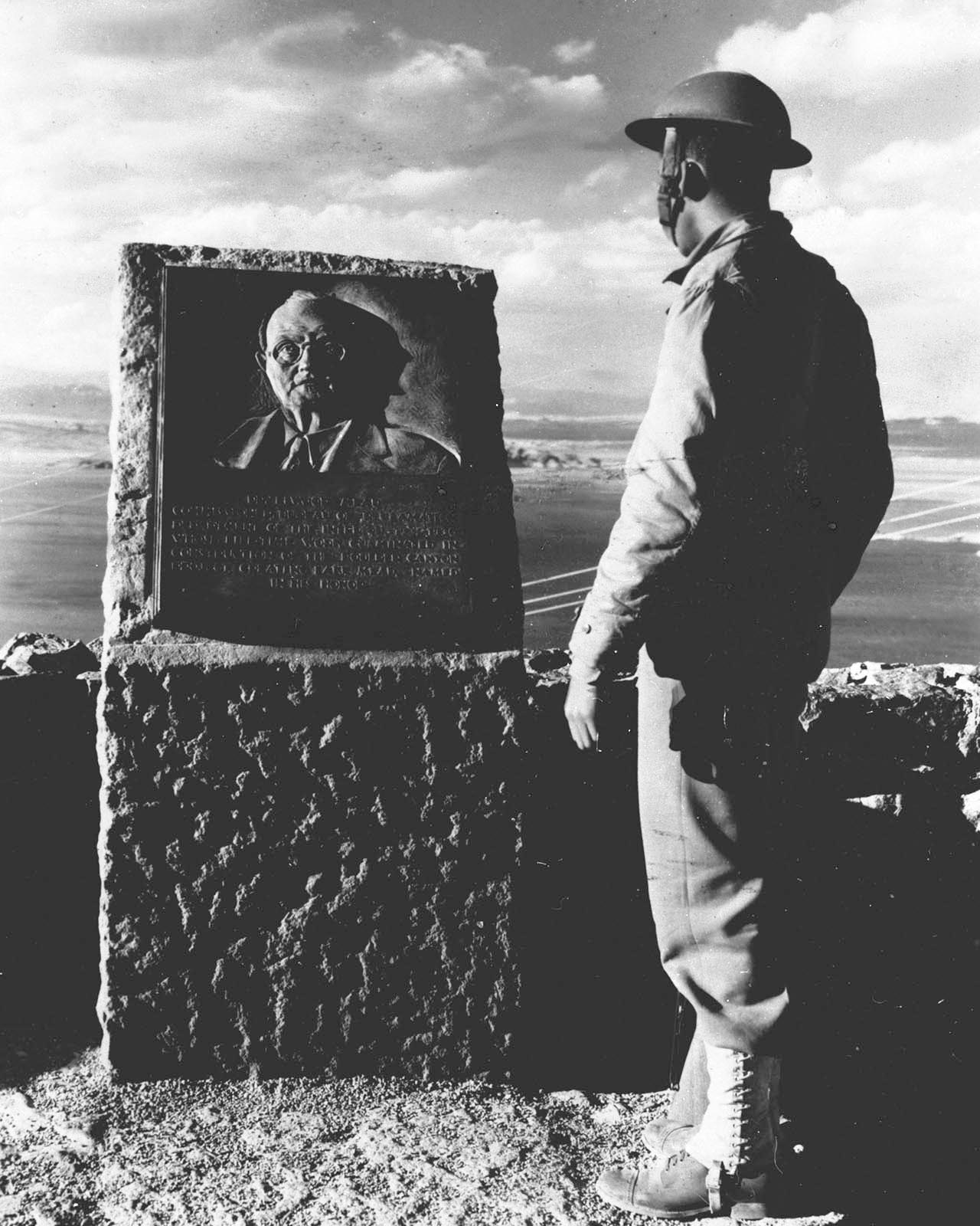 U.S. Army soldier at Elwood Mead commemorative plaque overlooking Lake Mead, CO, Jan. 1942.