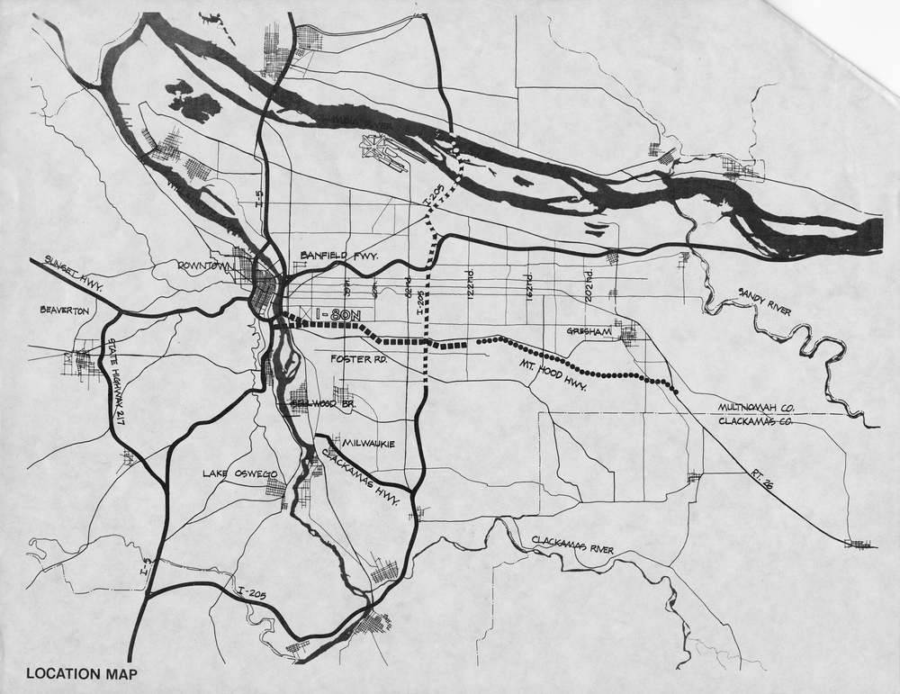 Image from publication "I-205 and Mount Hood Freeways: Facts and Alternatives." Proposed freeway is signified by dashed line running horizontally in center of image.