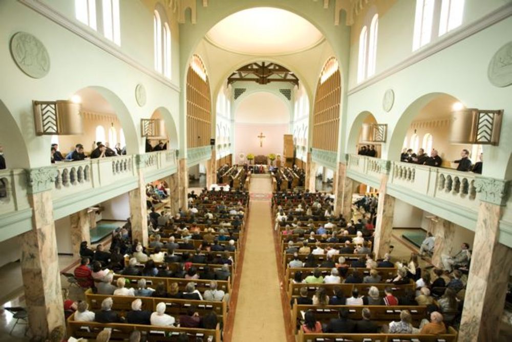 Inside church of Mt. Angel Abbey during graduation ceremony.