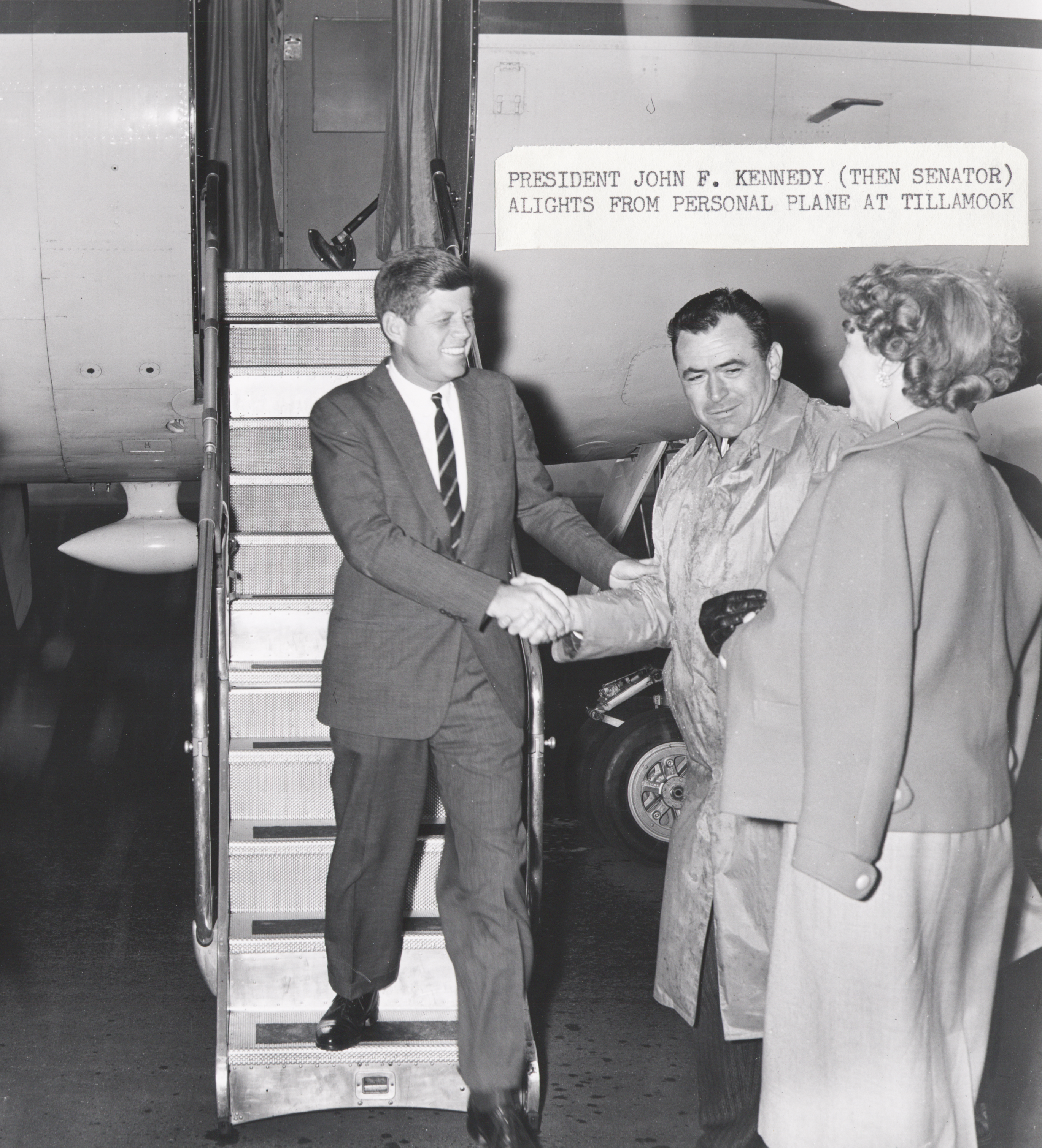 Local dignitaries greet Senator John F. Kennedy at Naval Air Station Tillamook, during Kenndy's presidential campaign, 1959.