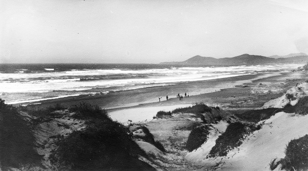 Beach at Newport with Yaquina Head in the distance, about 1900.