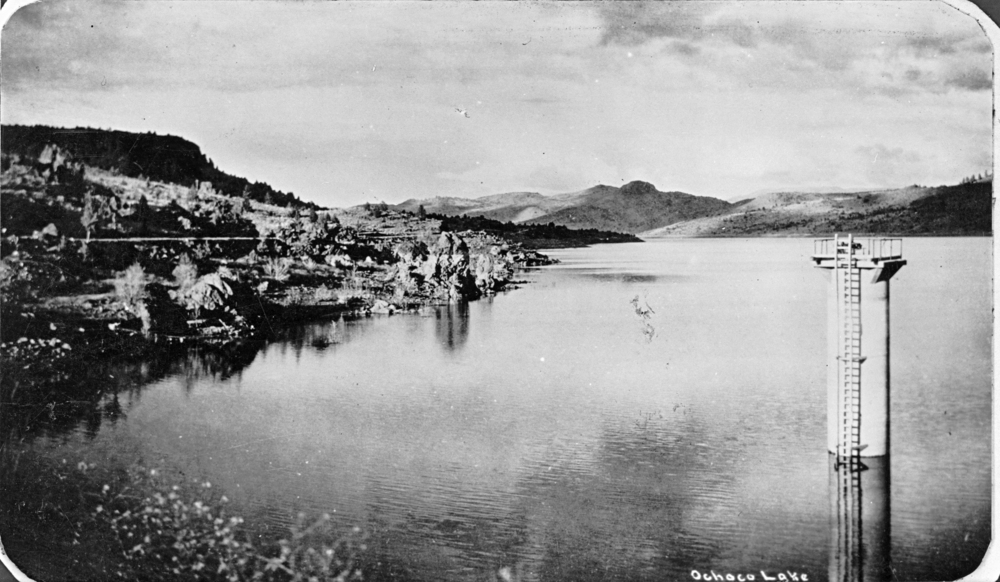 Gate tower of Ochoco Dam stands above Ochoco Lake, five miles east of Prineville, January 1931.
