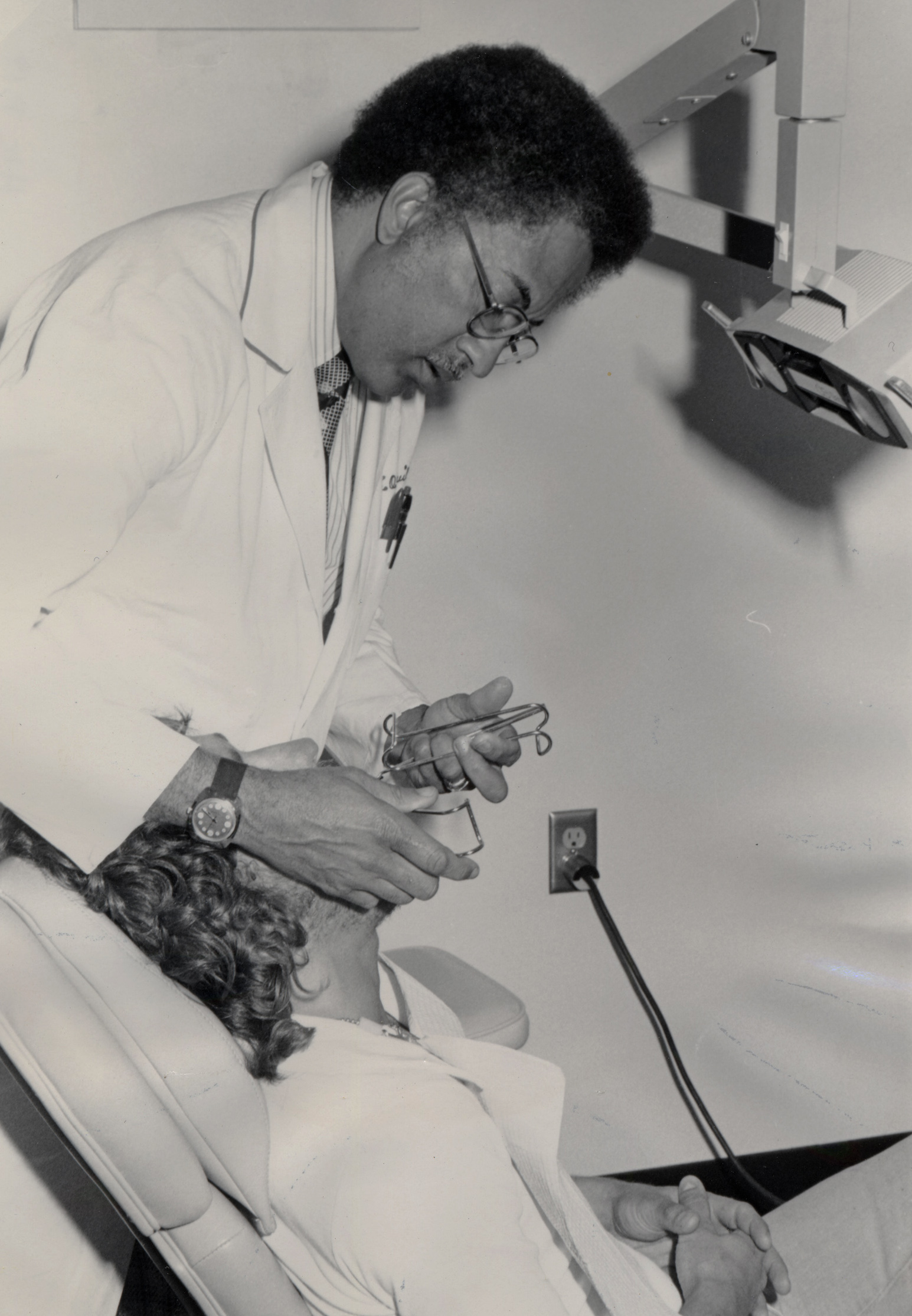 Dr. Clarence Pruitt with patient.