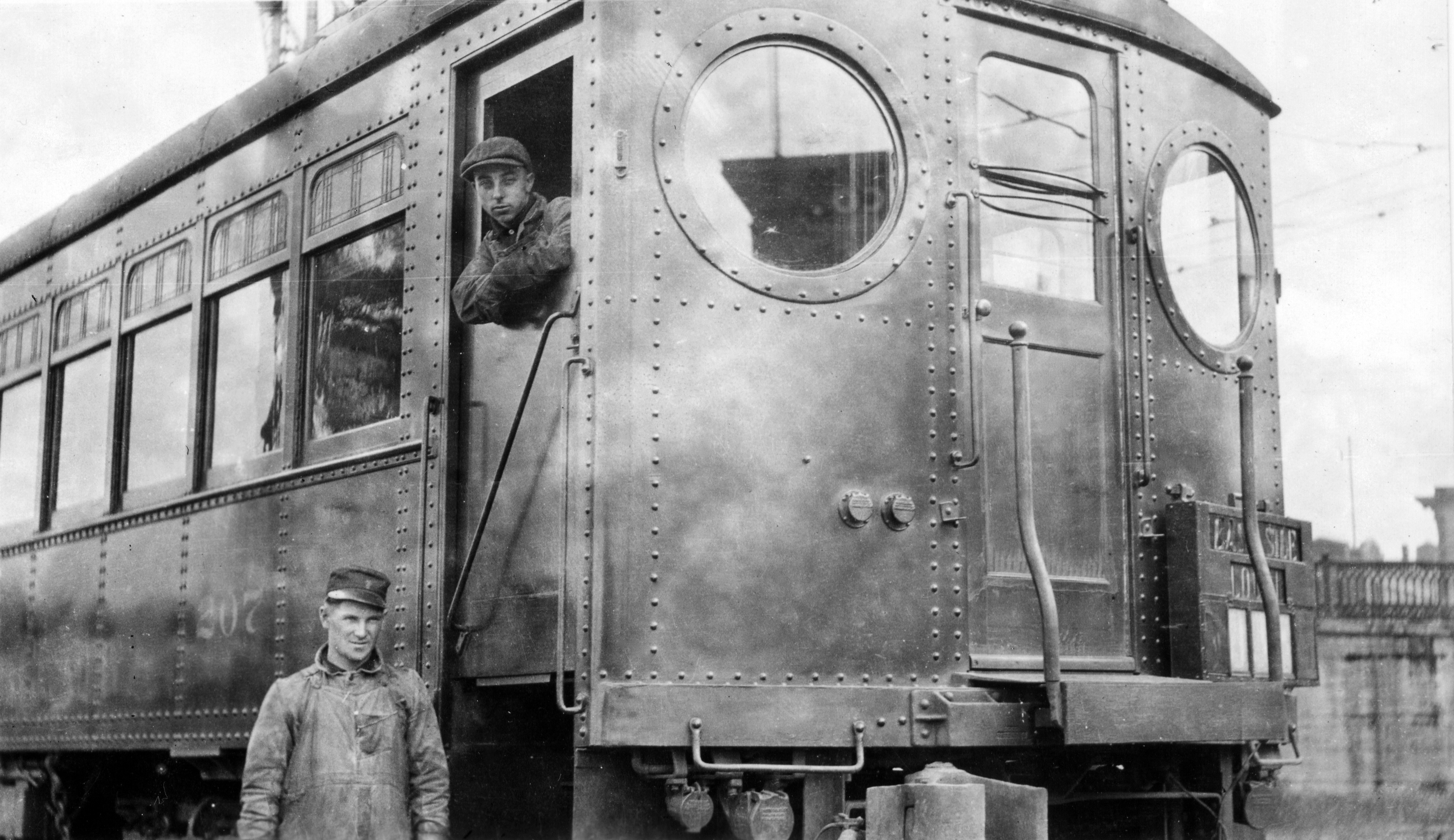 Hostler Gene Moell and assistant move Red Electric car 207 at Portland's Union Station, 1918.