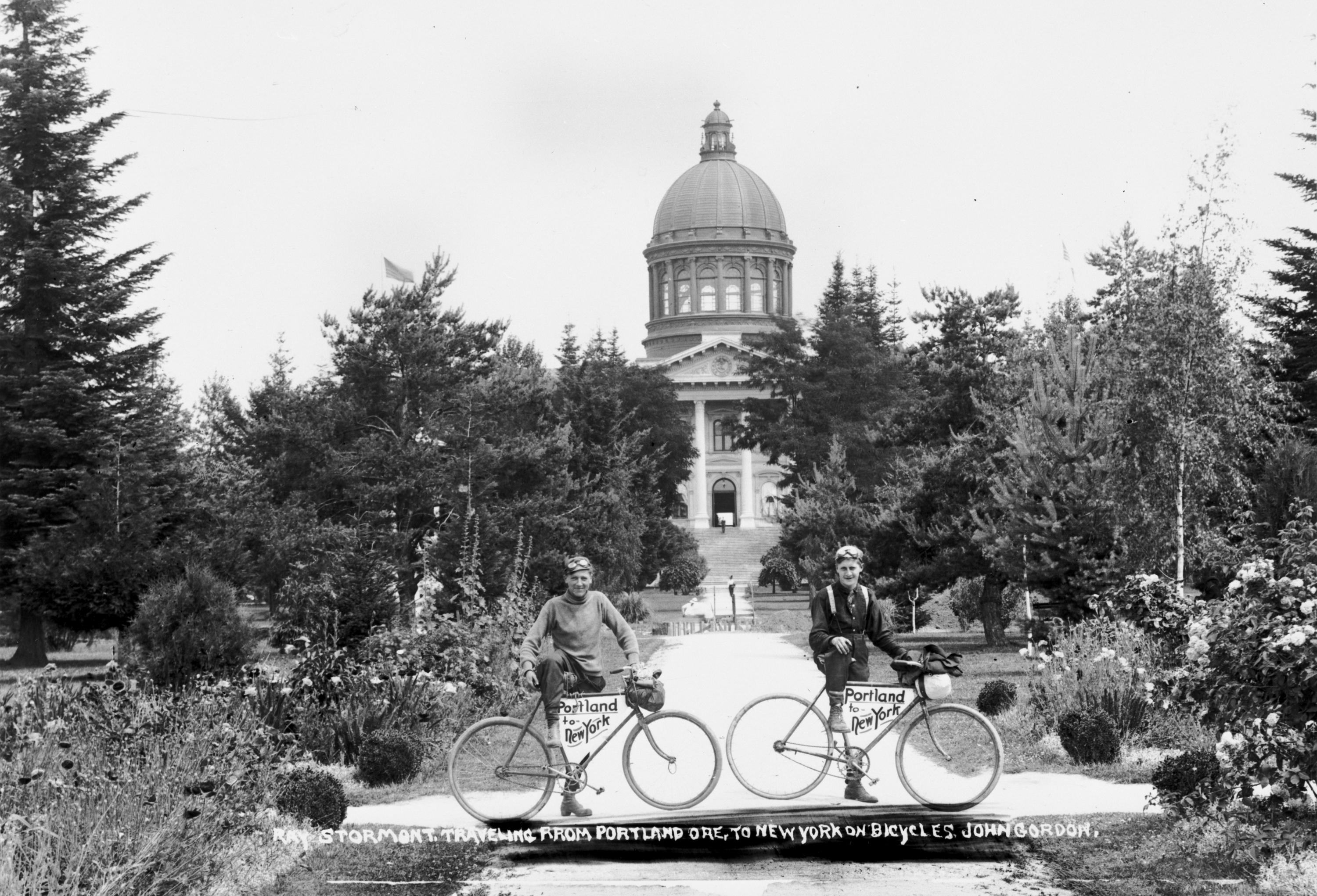 Ray Stormont and John Gordon in front of Oregon State Capitol during bicycle trip from Portland to New York.