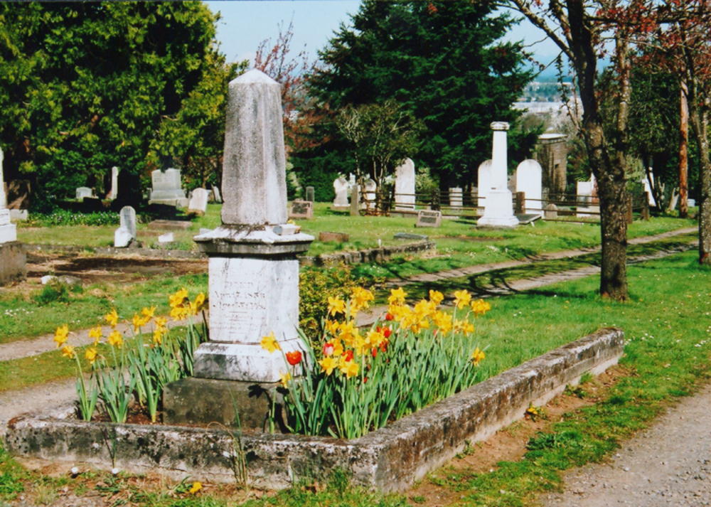 Island plot in central carriage drive, with monument of William H. Willson (1805-1856) and Chloe Clark Wilson (1818-1874) in foreground. Salem Pioneer Cemetery, 2008.