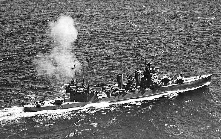 U.S.S. Astoria (CA-34) firing after eight-inch guns during training near Hawai'i, July 1942.