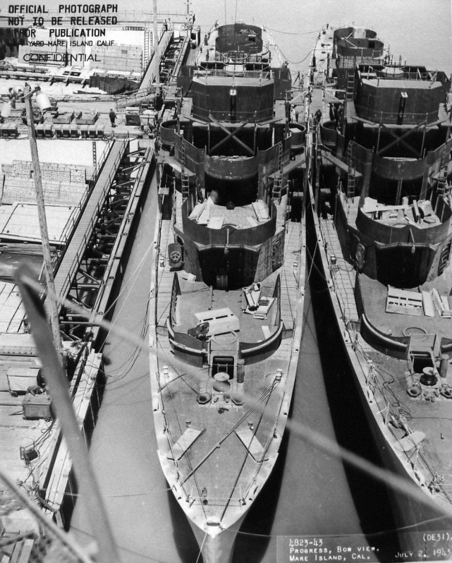 U.S.S. Sederstrom (DE-31) (l) and U.S.S. Fleming (DE 32) being outfitted at Mare Island Navy Yard, Calif., July 1943.