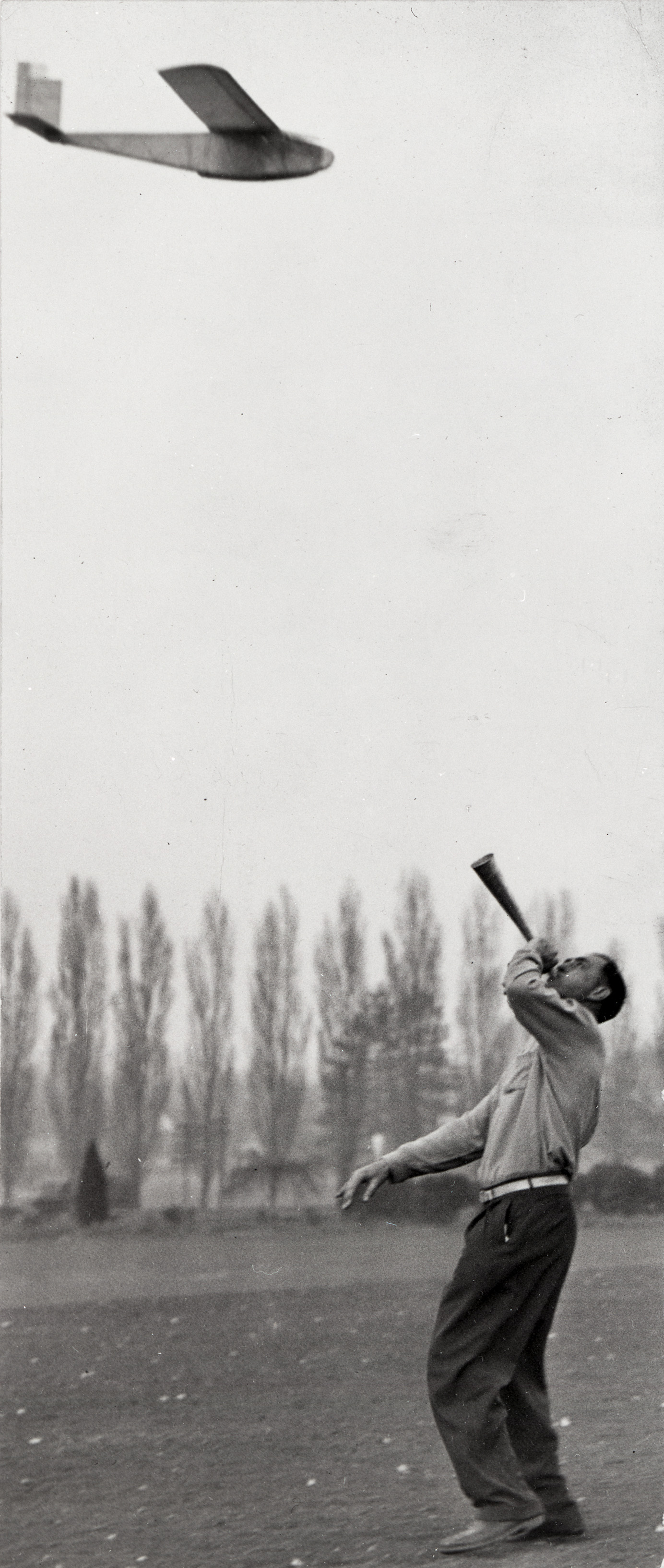 Jim Walker used a horn to guide the model airplane at Westmoreland Park.