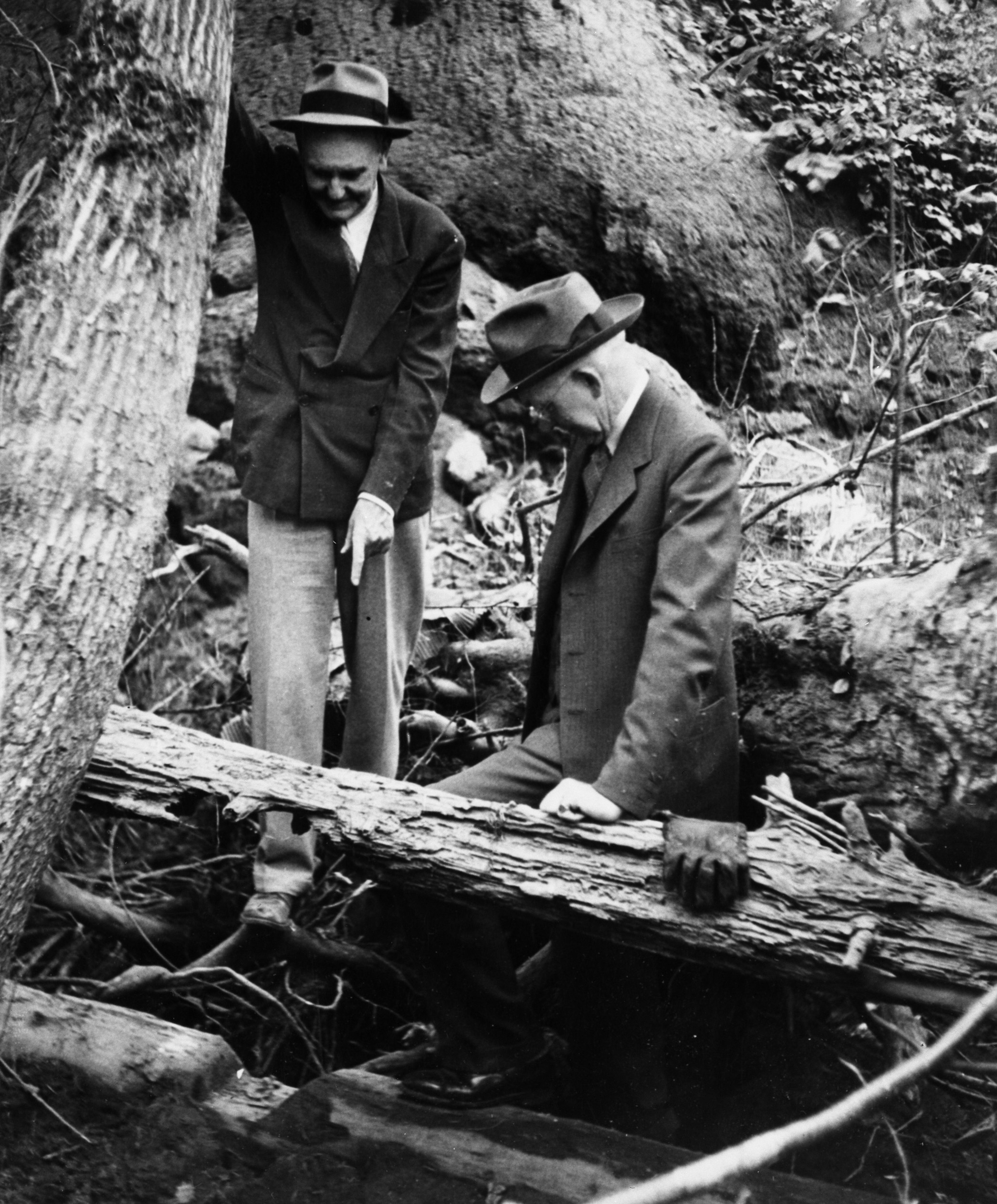 Oswald West (r) inspecting foundation of Gervais mill.