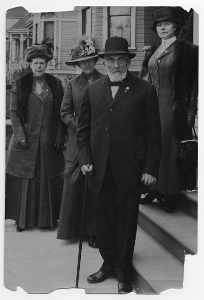 Esther Lovejoy appears on the building steps. The woman in the middle is Mrs. Mathews, and to the left is Mrs. Elizabeth Eggert. The gentleman is Francis Xavier Matthieu.