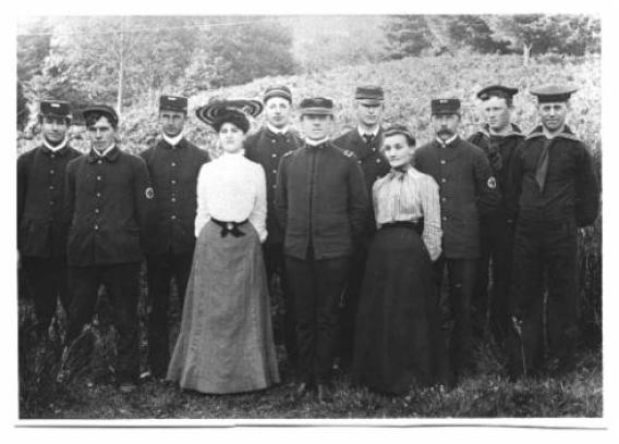Dr. Baylis Earle (officer in charge) in the center.