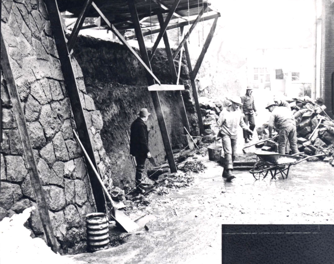 Conscientious objectors build a retaining wall