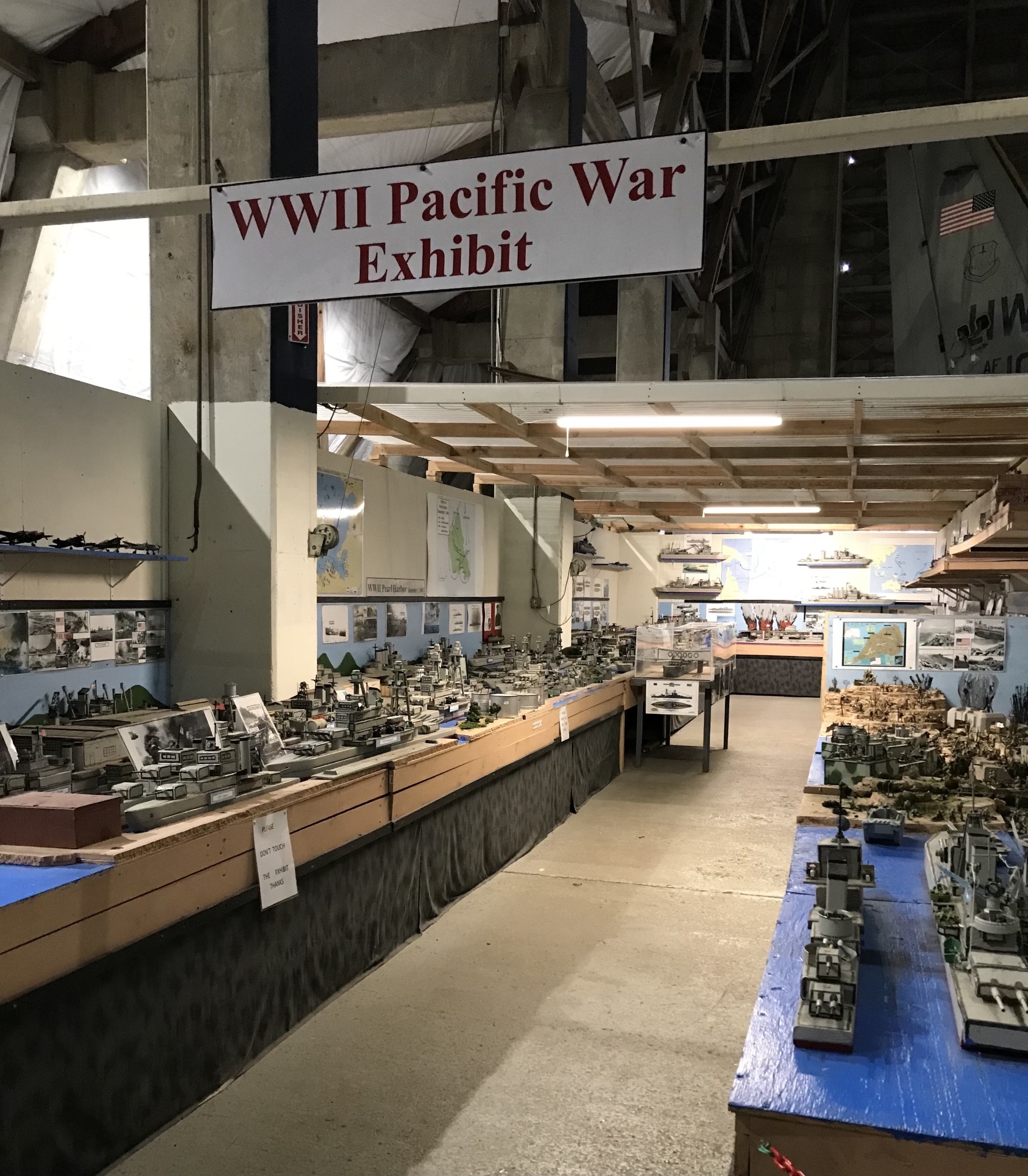 The WW II Pacific War Exhibit shows Japan's initial conquests and later Allied push back, ending in Japan's surrender. Key events include Pearl Harbor, the Battle of Midway, and the use of atomic bombs.