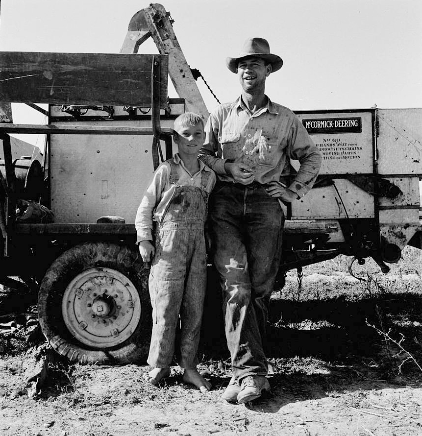 George Cleaver and his son on their farm.