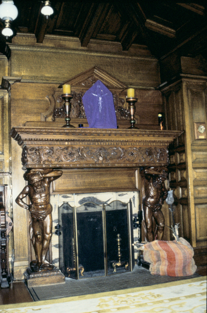 Dining room with carved fireplace.