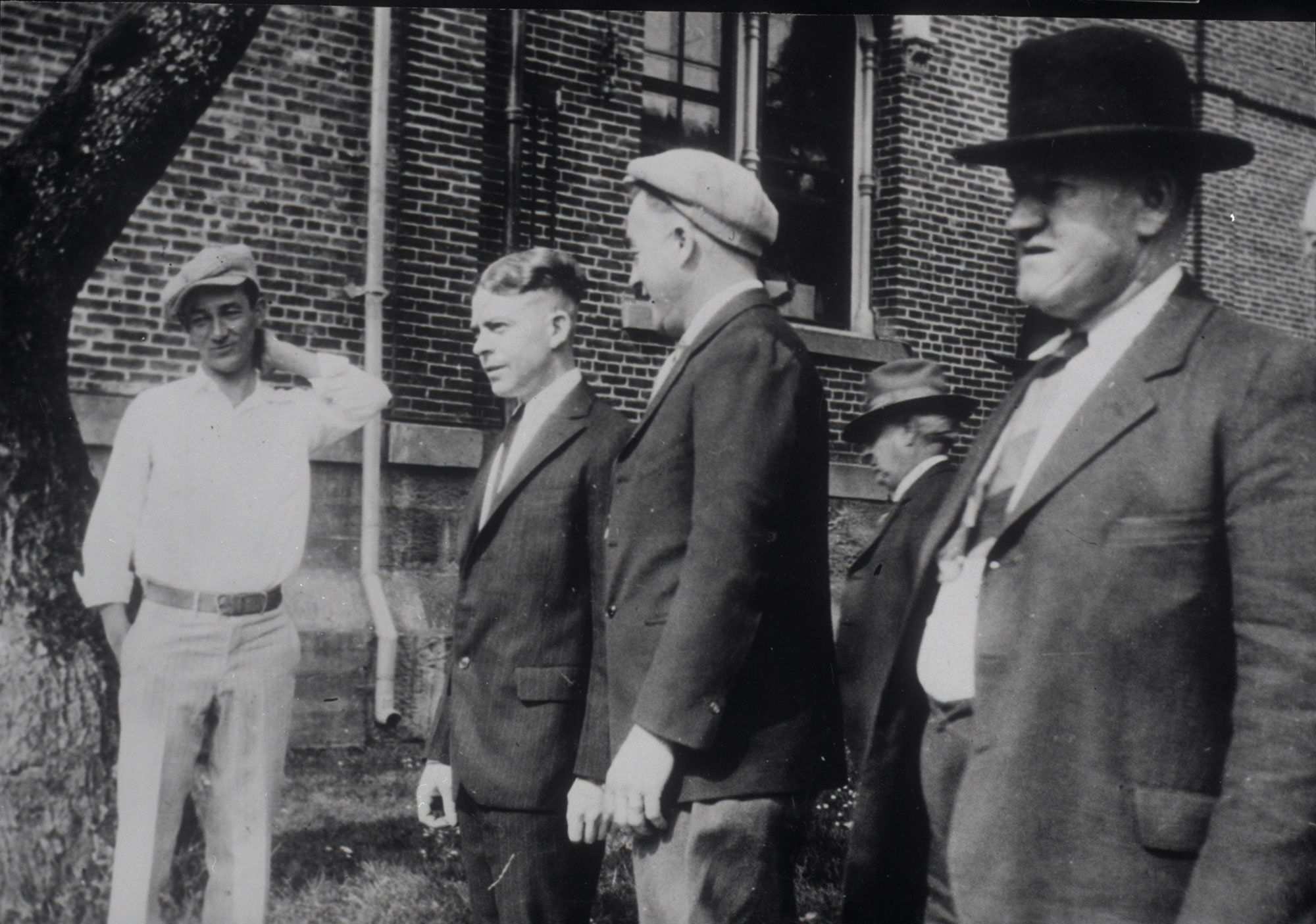 Pictured here from left are entertainer Pinto Colvig, defendant Hugh DeAutremont, jailer Ike Dunford, and an unknown man identified as Mr. Luzinoff. Note: Jacksonville was the seat of Jackson County up through 1927, when it was moved to Medford.